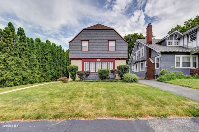 1151 Oxford Pl, Schenectady, NY 12308 - colonial inspired home with a front lawn and a chimney