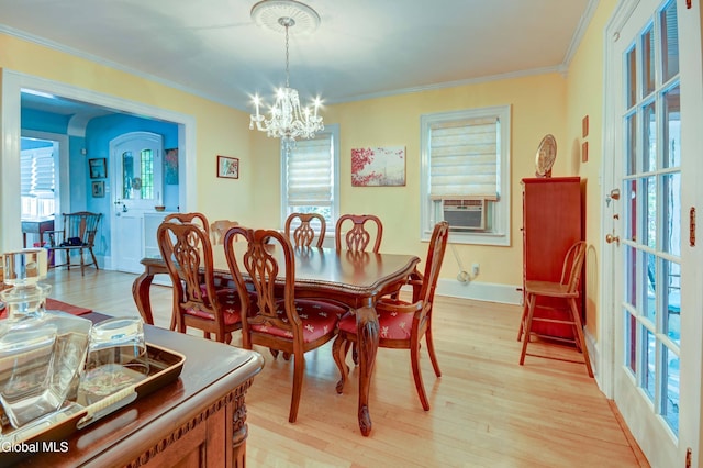 1151 Oxford Pl, Schenectady, NY 12308 - dining area with cooling unit, light wood-type flooring, a chandelier, and crown molding