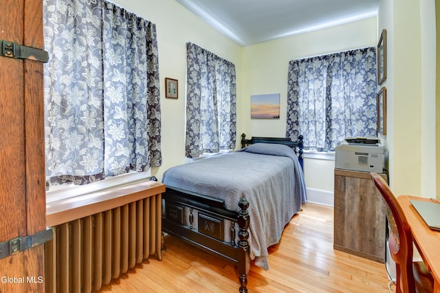 1151 Oxford Pl, Schenectady, NY 12308 - bedroom featuring wood finished floors and radiator heating unit