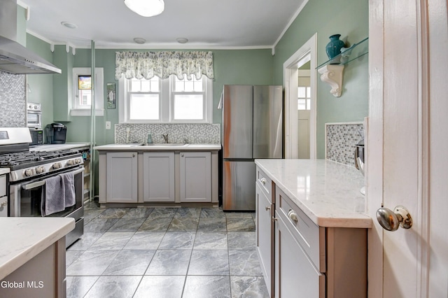 1151 Oxford Pl, Schenectady, NY 12308 - kitchen with wall chimney exhaust hood, appliances with stainless steel finishes, crown molding, tasteful backsplash, and light stone counters