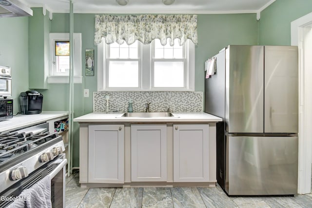 1151 Oxford Pl, Schenectady, NY 12308 - kitchen featuring stainless steel appliances, light countertops, backsplash, ornamental molding, and extractor fan
