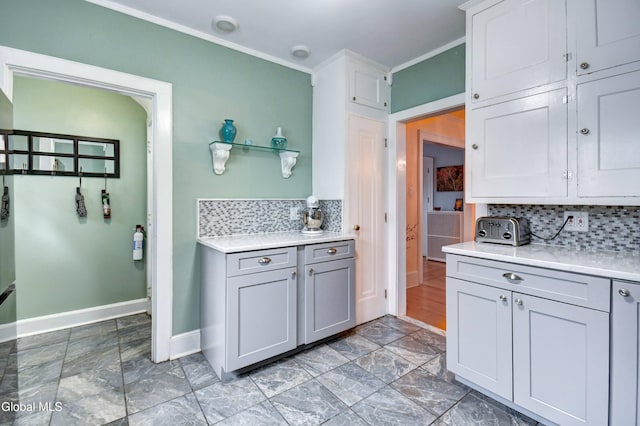 1151 Oxford Pl, Schenectady, NY 12308 - kitchen featuring backsplash, light countertops, gray cabinets, and crown molding
