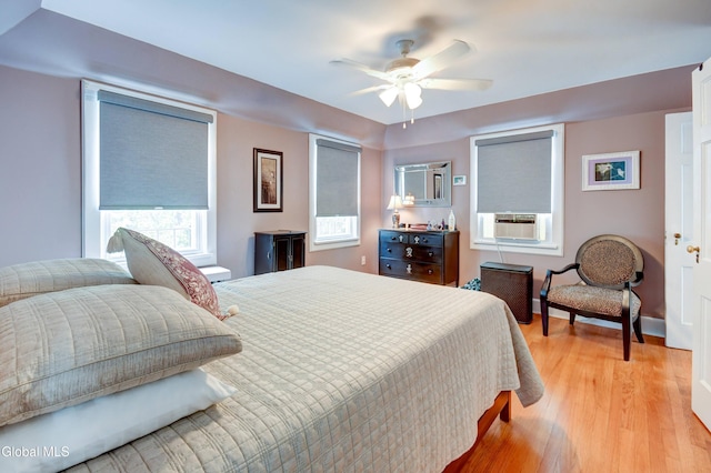 1151 Oxford Pl, Schenectady, NY 12308 - bedroom featuring cooling unit, light wood-type flooring, and a ceiling fan