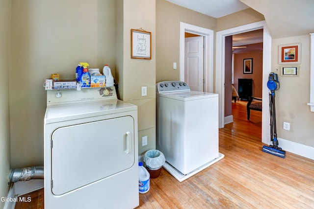 1151 Oxford Pl, Schenectady, NY 12308 - laundry area with separate washer and dryer and wood finished floors