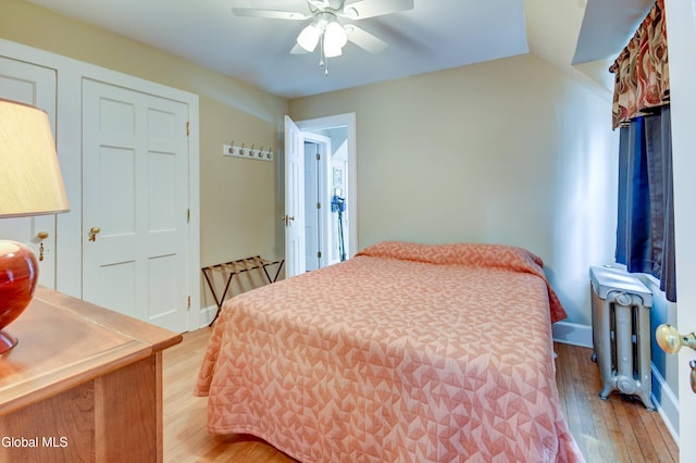 1151 Oxford Pl, Schenectady, NY 12308 - bedroom with radiator heating unit, light wood-style flooring, and ceiling fan