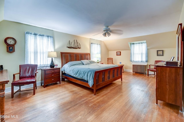1151 Oxford Pl, Schenectady, NY 12308 - bedroom featuring radiator, lofted ceiling, light wood-style flooring, and multiple windows