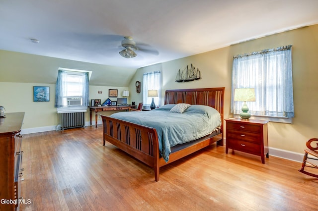 1151 Oxford Pl, Schenectady, NY 12308 - bedroom with radiator, wood finished floors, multiple windows, lofted ceiling, and ceiling fan