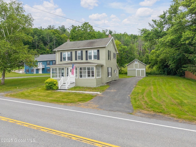 1707 Helderberg Trl, Berne, NY 12023 - view of front facade featuring a chimney, an outbuilding, a garage, and a front yard
