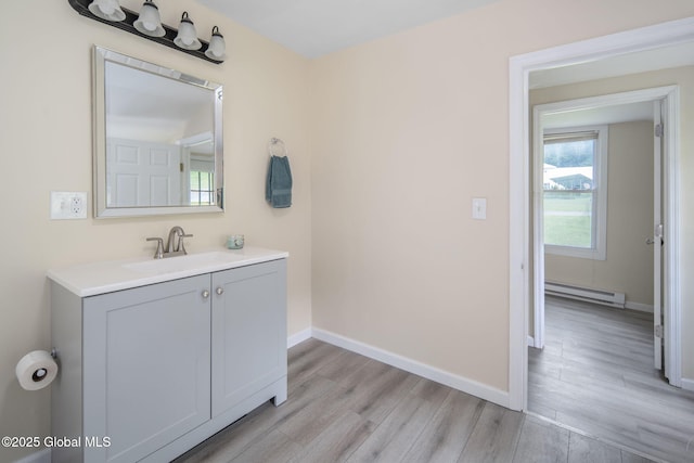 1707 Helderberg Trl, Berne, NY 12023 - bathroom with a baseboard heating unit, wood finished floors, and vanity