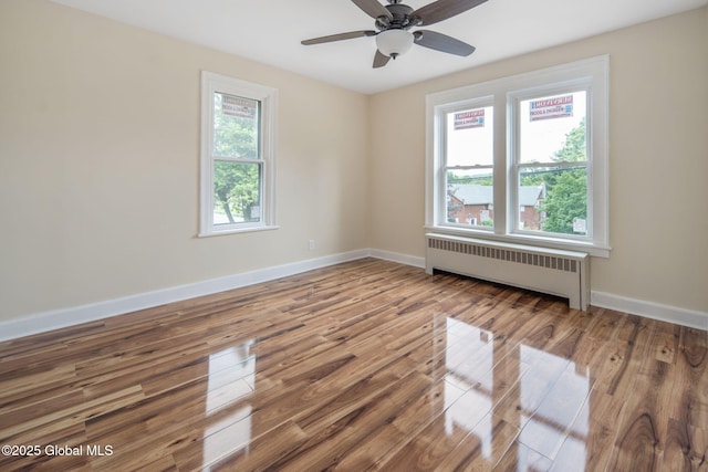 1707 Helderberg Trl, Berne, NY 12023 - empty room featuring radiator, wood finished floors, and a ceiling fan