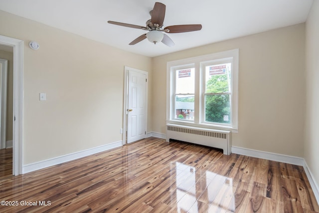 1707 Helderberg Trl, Berne, NY 12023 - empty room with radiator heating unit, wood finished floors, and ceiling fan