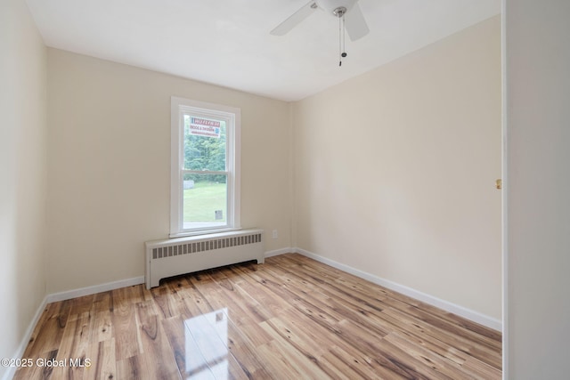 1707 Helderberg Trl, Berne, NY 12023 - spare room featuring radiator, wood finished floors, and a ceiling fan