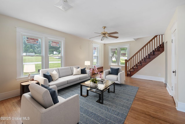 1707 Helderberg Trl, Berne, NY 12023 - living area with wood finished floors, stairs, and ceiling fan