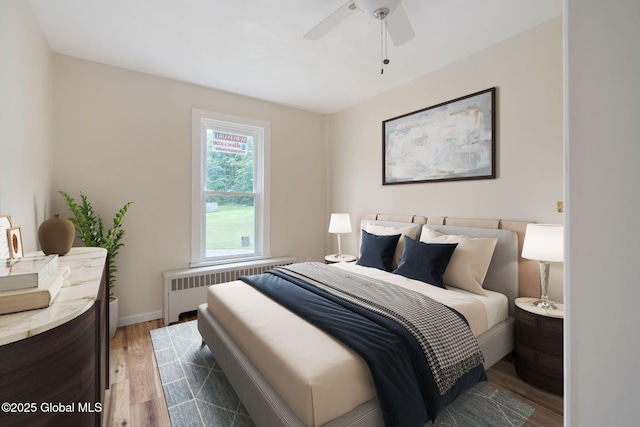 1707 Helderberg Trl, Berne, NY 12023 - bedroom featuring radiator, wood finished floors, and ceiling fan