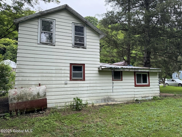114 State Route 146, Wright, NY 12157 - view of side of home with oil tank, a yard, and a metal roof