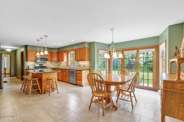 630 Salvia Ln, Guilderland, NY 12303 - dining space featuring a chandelier, light tile patterned floors, and recessed lighting