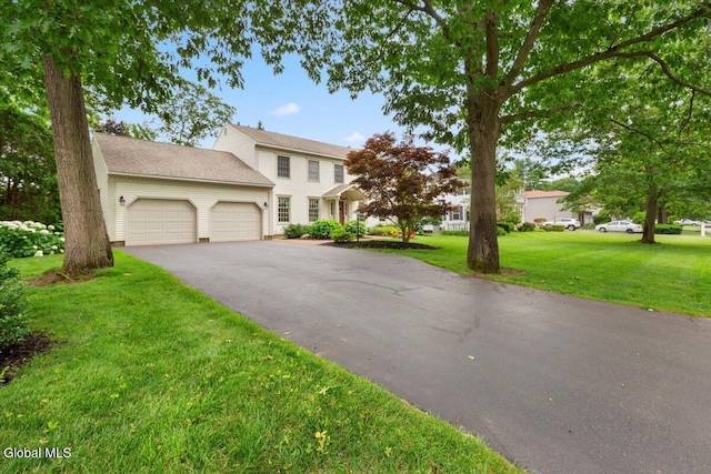 630 Salvia Ln, Guilderland, NY 12303 - view of front of house featuring a garage, asphalt driveway, and a front yard