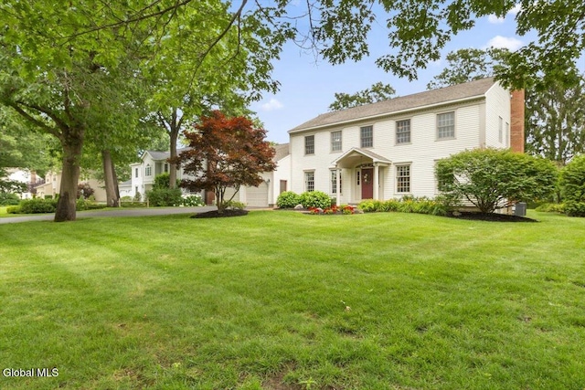 630 Salvia Ln, Guilderland, NY 12303 - colonial inspired home featuring a chimney and a front lawn