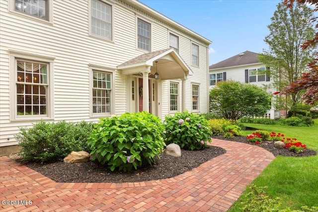 630 Salvia Ln, Guilderland, NY 12303 - view of exterior entry featuring a lawn
