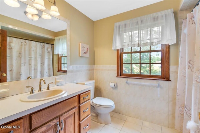 630 Salvia Ln, Guilderland, NY 12303 - bathroom with vanity, tile walls, tile patterned floors, a wainscoted wall, and a shower with curtain