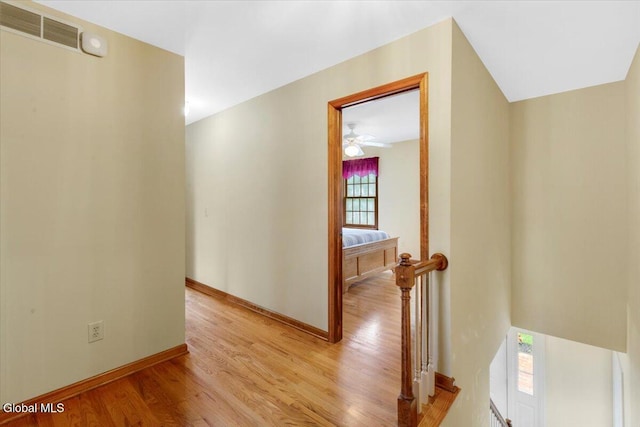 630 Salvia Ln, Guilderland, NY 12303 - hall featuring light wood-style flooring and an upstairs landing