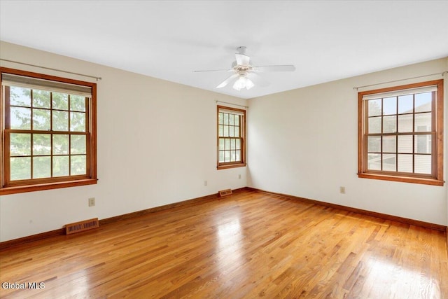 630 Salvia Ln, Guilderland, NY 12303 - unfurnished room featuring plenty of natural light, light wood-style flooring, and a ceiling fan