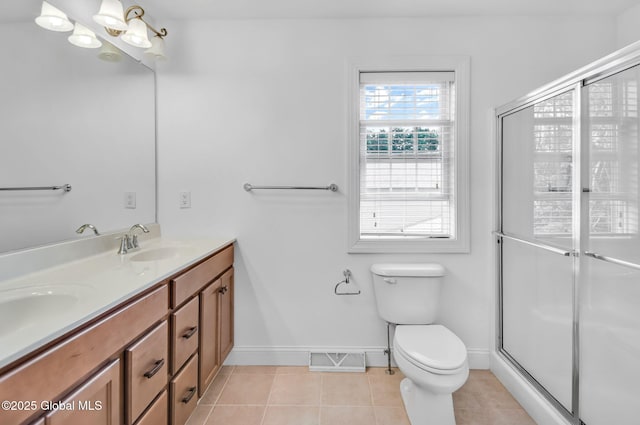 21 Beacon Dr, Colonie, NY 12189 - bathroom with double vanity, tile patterned floors, and an enclosed shower