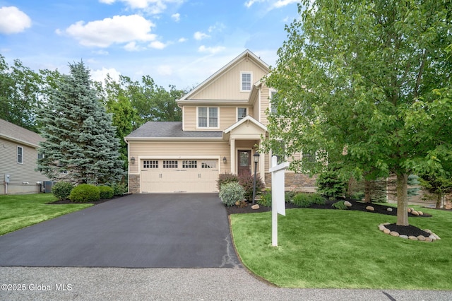 21 Beacon Dr, Colonie, NY 12189 - view of front facade with driveway, a front yard, and stone siding