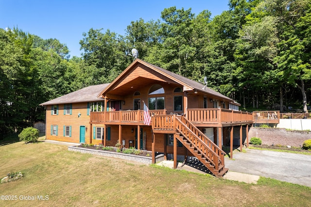 345 Goodman Rd, Fort Ann, NY 12827 - view of front facade with stairway, a deck, a front lawn, and asphalt driveway