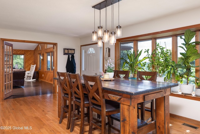 345 Goodman Rd, Fort Ann, NY 12827 - dining room featuring light wood finished floors and wooden walls