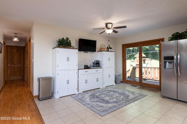 345 Goodman Rd, Fort Ann, NY 12827 - kitchen featuring stainless steel fridge with ice dispenser, ceiling fan, dark countertops, and white cabinets