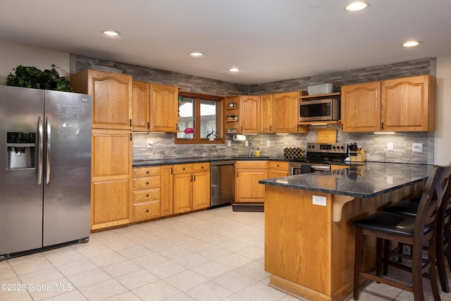 345 Goodman Rd, Fort Ann, NY 12827 - kitchen with appliances with stainless steel finishes, a peninsula, backsplash, recessed lighting, and brown cabinets