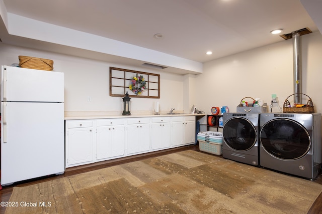 345 Goodman Rd, Fort Ann, NY 12827 - laundry room featuring cabinet space, washer and clothes dryer, wood finished floors, and recessed lighting