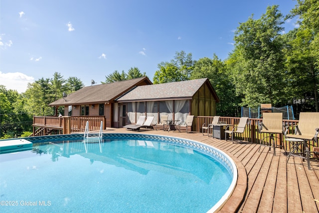 345 Goodman Rd, Fort Ann, NY 12827 - swimming pool with a wooden deck and a sunroom