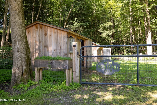 345 Goodman Rd, Fort Ann, NY 12827 - view of outdoor structure featuring a forest view and a gate