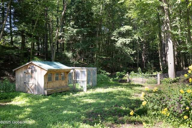 345 Goodman Rd, Fort Ann, NY 12827 - view of yard with an outdoor structure, exterior structure, and a view of trees