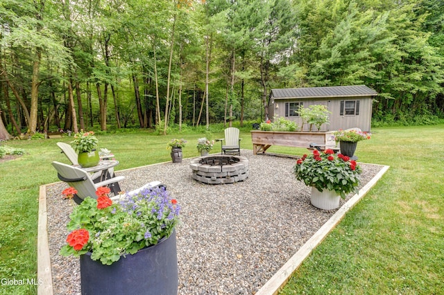 2794 W Lydius St, Schenectady, NY 12306 - view of patio / terrace featuring a fire pit, an outbuilding, and a view of trees