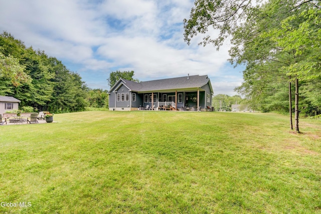 2794 W Lydius St, Schenectady, NY 12306 - view of grassy yard with a patio area and a fire pit