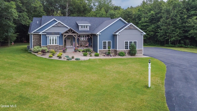 2794 W Lydius St, Schenectady, NY 12306 - craftsman-style house featuring stone siding, a front lawn, covered porch, a shingled roof, and driveway