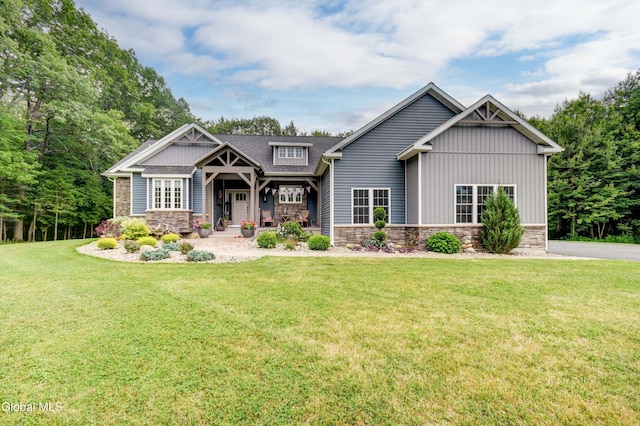2794 W Lydius St, Schenectady, NY 12306 - craftsman-style house featuring stone siding, a front lawn, and board and batten siding