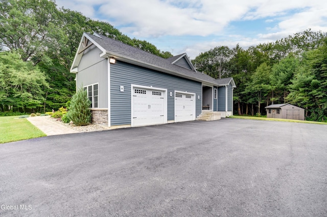 2794 W Lydius St, Schenectady, NY 12306 - garage with asphalt driveway and a shed