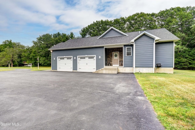 2794 W Lydius St, Schenectady, NY 12306 - ranch-style home featuring a garage, a front yard, asphalt driveway, roof with shingles, and view of scattered trees