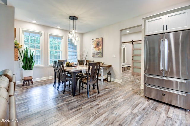 2794 W Lydius St, Schenectady, NY 12306 - dining room with a barn door, light wood-style floors, recessed lighting, and a chandelier