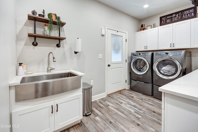 2794 W Lydius St, Schenectady, NY 12306 - washroom featuring washer and clothes dryer, cabinet space, light wood finished floors, and recessed lighting