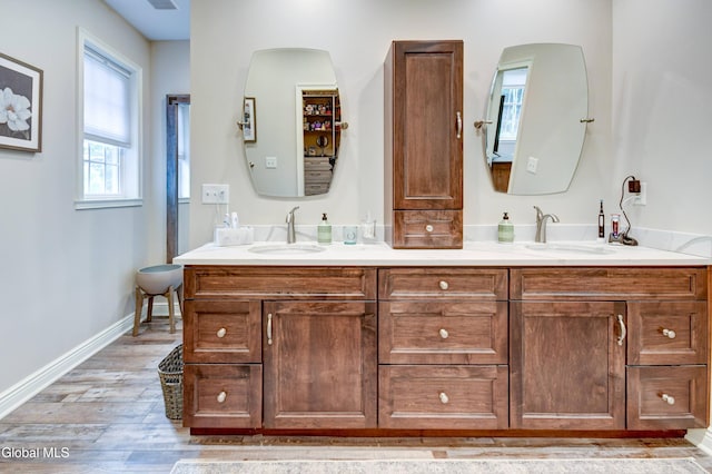 2794 W Lydius St, Schenectady, NY 12306 - bathroom featuring double vanity and wood finished floors