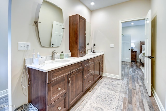 2794 W Lydius St, Schenectady, NY 12306 - ensuite bathroom featuring double vanity, wood finished floors, and recessed lighting