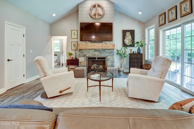 2794 W Lydius St, Schenectady, NY 12306 - living area with wood finished floors, a stone fireplace, high vaulted ceiling, and recessed lighting