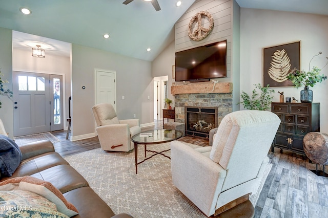 2794 W Lydius St, Schenectady, NY 12306 - living room with wood finished floors, high vaulted ceiling, a stone fireplace, ceiling fan, and recessed lighting