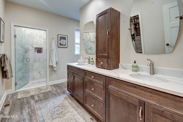 2794 W Lydius St, Schenectady, NY 12306 - full bathroom featuring a marble finish shower, double vanity, and wood finished floors