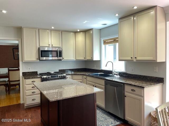 6 Patroon Way, Halfmoon, NY 12065 - kitchen featuring stainless steel appliances, dark stone counters, a center island, dark wood-style flooring, and recessed lighting